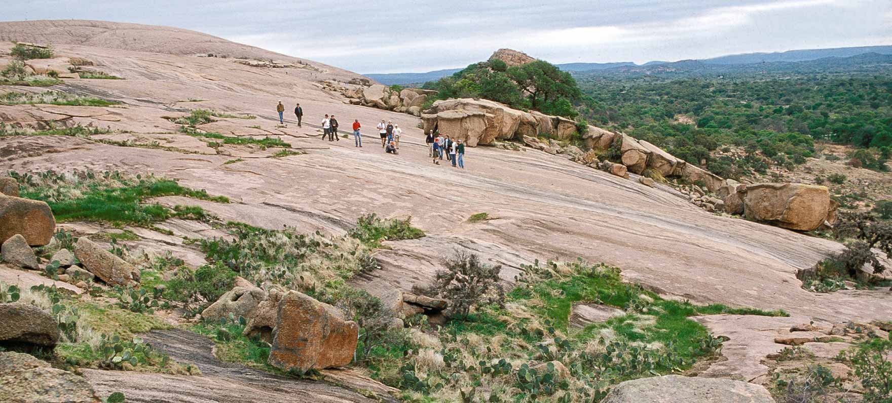 Make it an unforgettable family getaway from Houston  by hiking Enchanted Rock. Photo courtesy Passport to Texas.